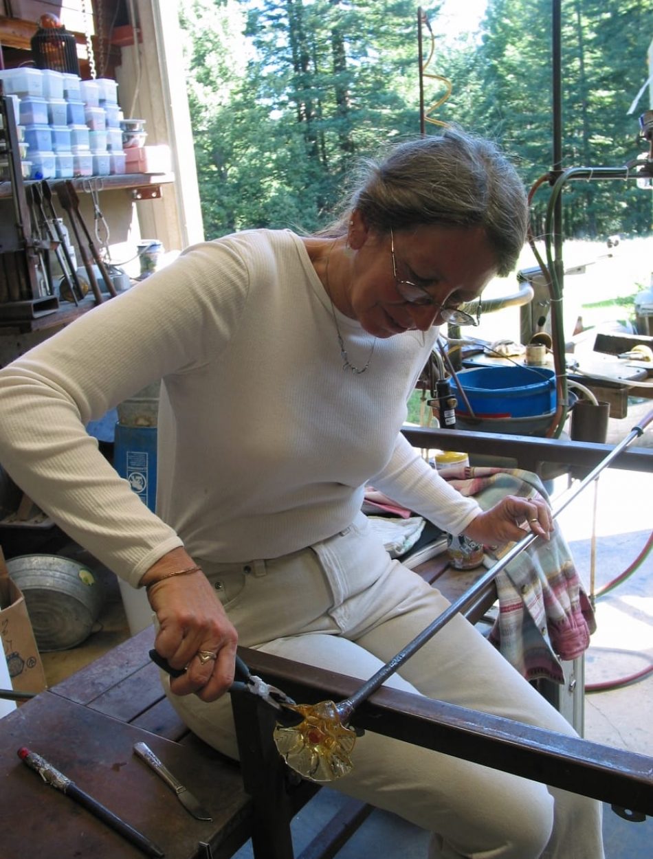 Leslie making glass flowers for commissioned Chandelier
